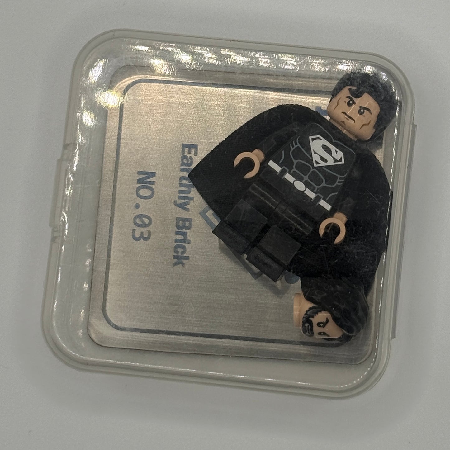 EARTHLY BRICK BLACK SUIT SUPERMAN